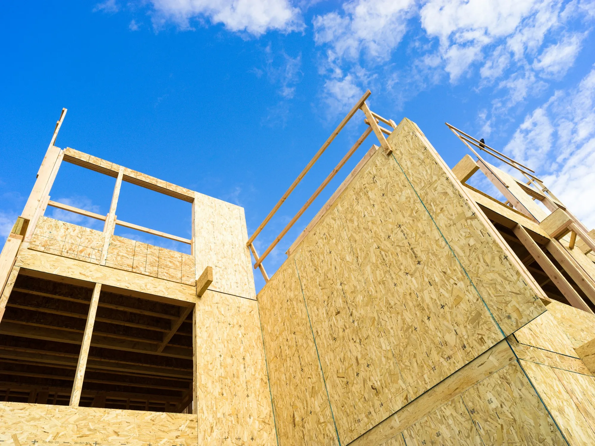 Wood framing with sheathing on a house under construction